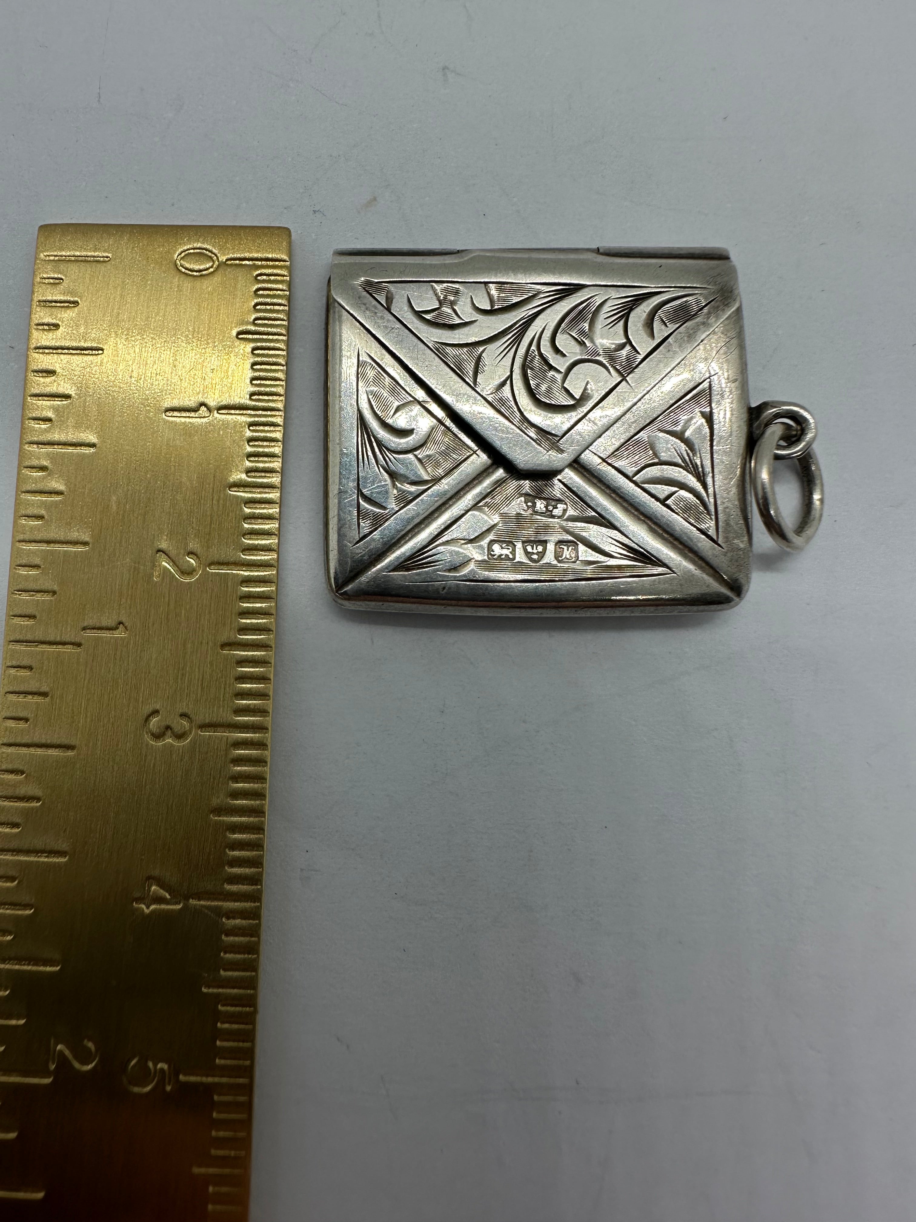 Silver stamp pendant