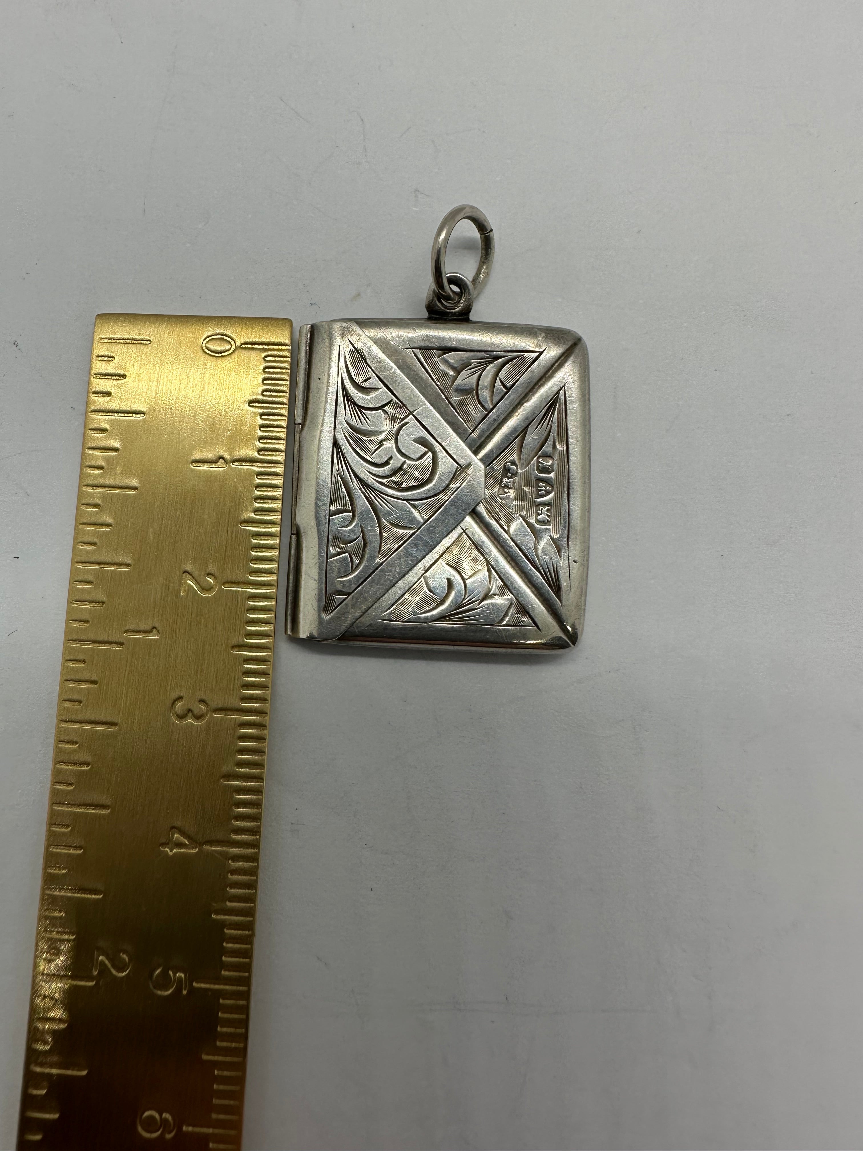 Silver stamp pendant