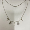 Silver letter and charm necklace