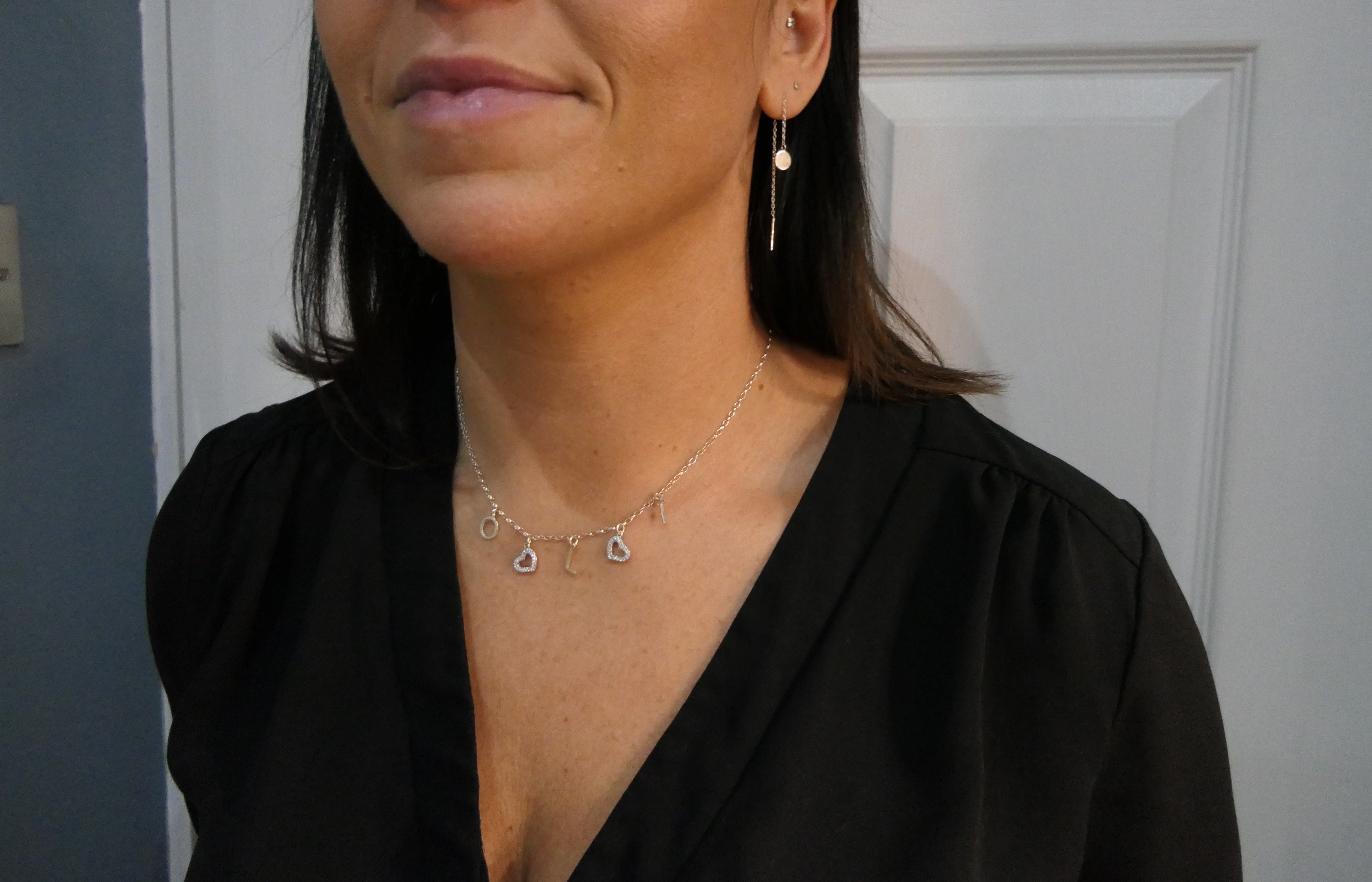 model wearing charm necklace